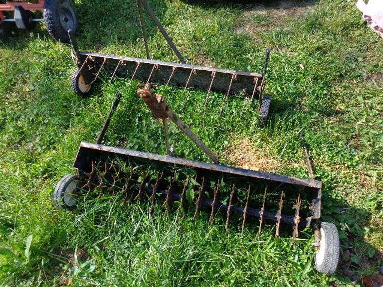1 Thatcher and 1 Aerator. Located by building.