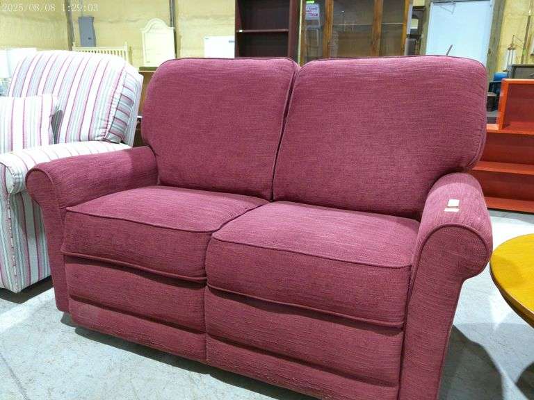 604- upholstered love seat minimal wear and in fair condition, both ends recline