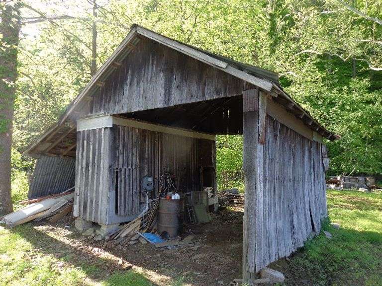 Corn Crib Shed. Must be taken down by buyer. Includes all contents: barn wood, barn metal, windows, 
