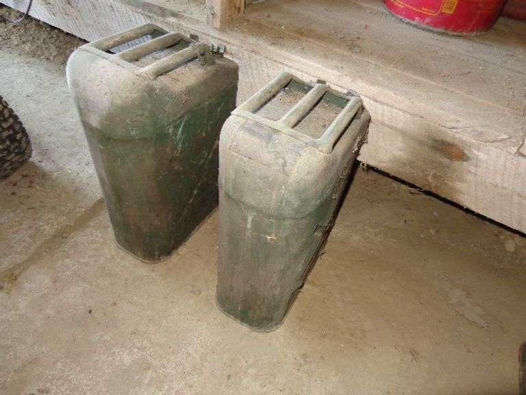 2 Military Cans. Located in old barn.