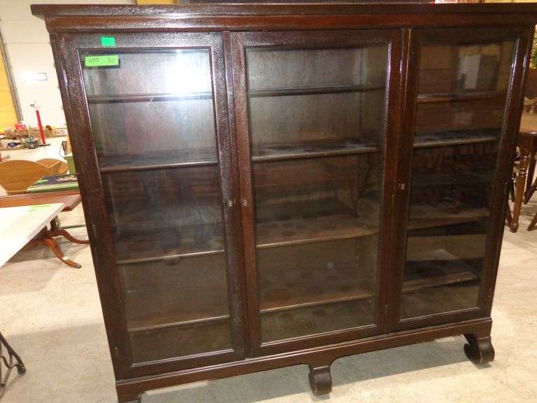 655- Vintage wood bookcase cabinet with 3 glass doors, 4 wooden shelves, has key, Style is Mission o