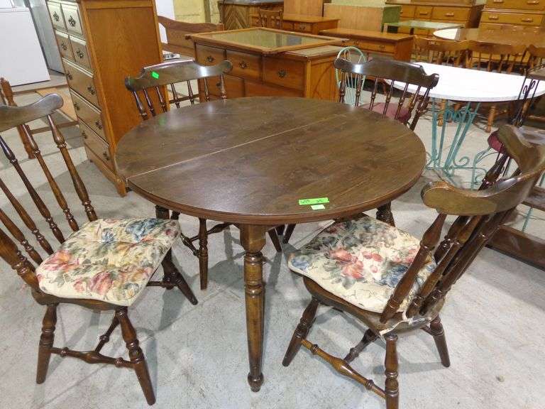 655- Wooden dinette table with 42" top and 4 chairs- 1 captain, 2 extra 12" leaves