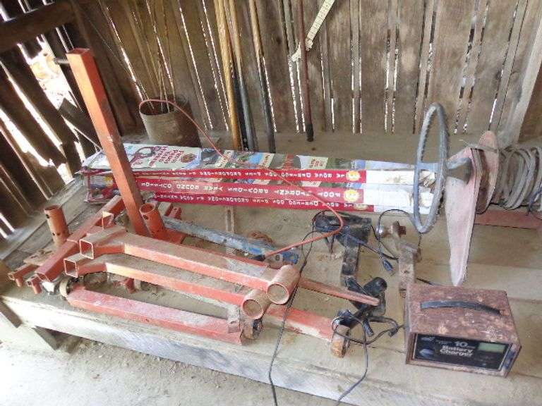 Three frost proof yard hydrants in boxes, Engine stand (taken apart), 10 AMP Sears battery charger, 