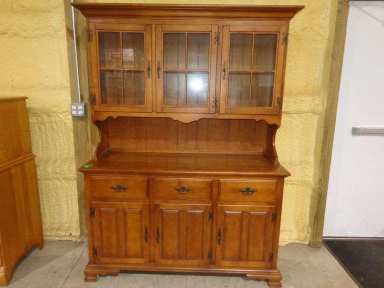 654 - Early American hutch by Keller. Top has glass doors, lower storage with drawers and doors. Har