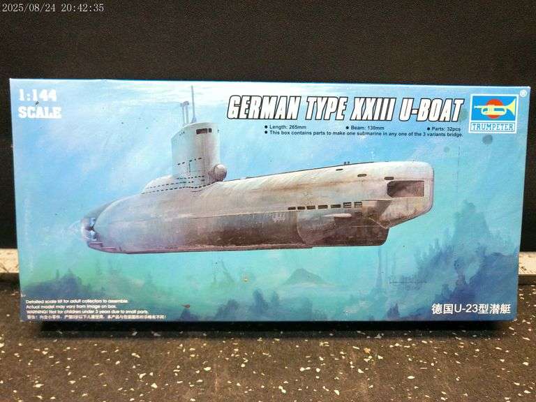 German U-boat, German battleship, two Japanese light cruisers models. See photos for scale.