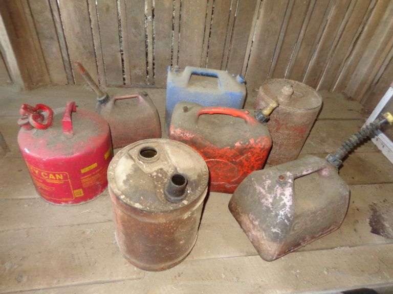 Miscellaneous old kerosene and gas cans. Located in bay 2 of old barn.
