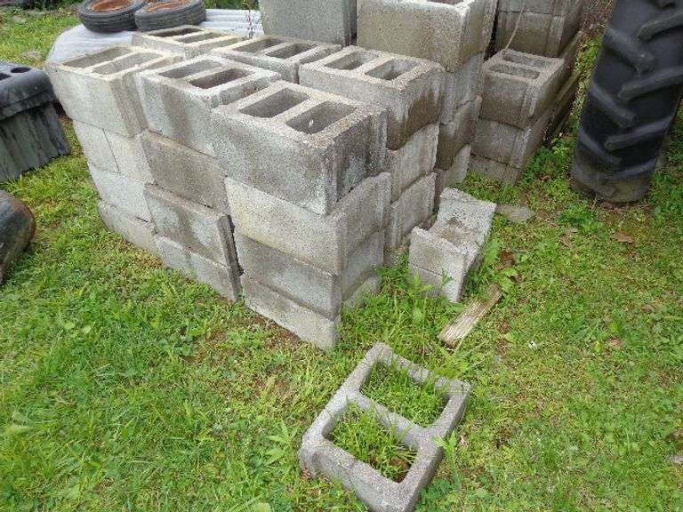 Lot of Cement Blocks. 8"x12"x15". Approximately 50 plus blocks. Located by Truck bed.