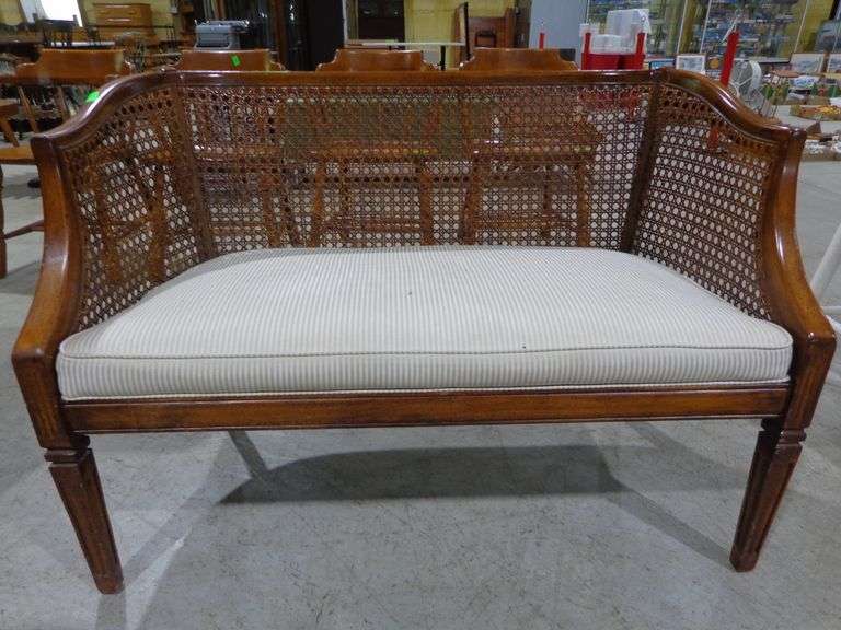 655- Settee with curved cane back and upholstered seat cushion
