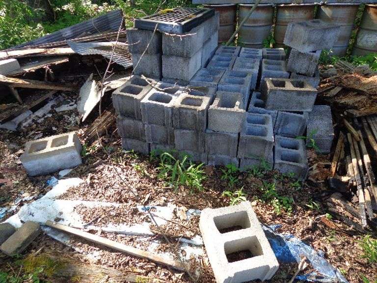 Lot of Cement Blocks. 8"x12"x15". Approximately 45 Plus. Located by barn by the creek.