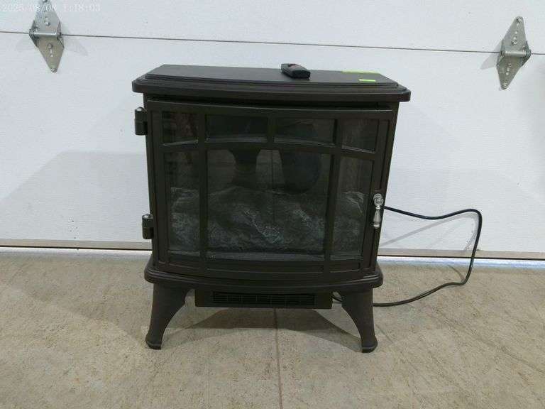 606- Black electric fireplace with remote 25" wide 10" deep 24" tall