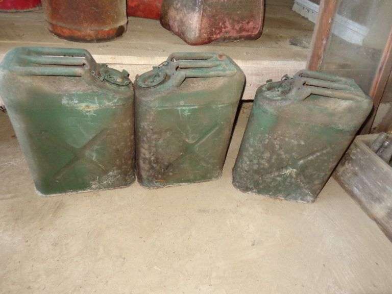3 Military Cans. Located in old barn.
