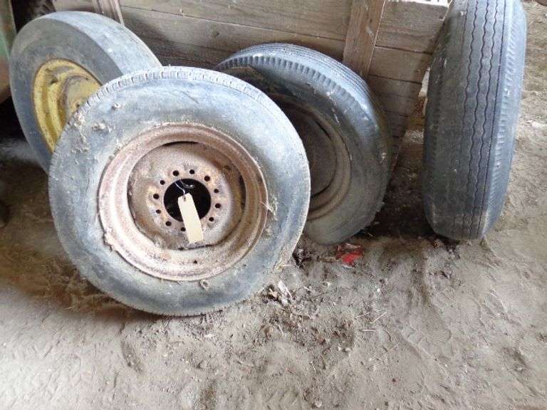 4 implement rim and tires, tires are no good