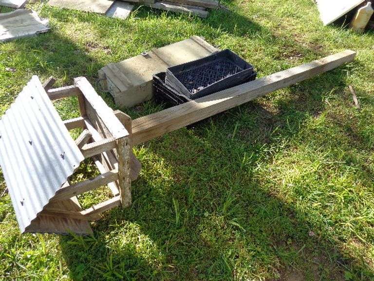 Bird Feeder on 4x4 post. Plant starter containers. Wooden Ammo box. Located by corn crib.