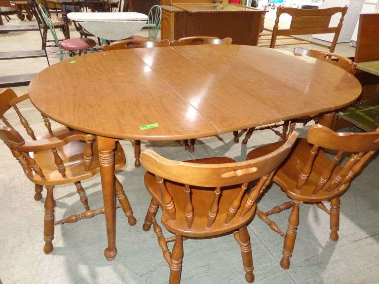 654 - Maple dinette table and 1 captain's chair and 5 side chairs. Table top is veneer