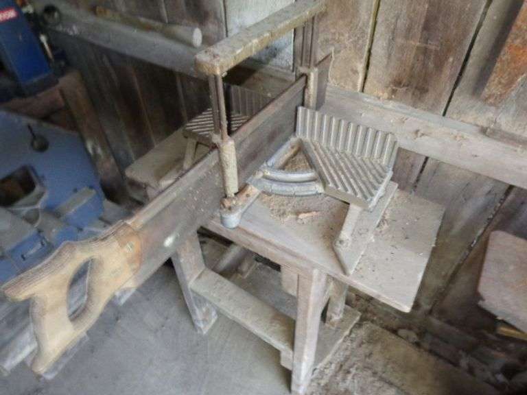 Manual Mitre Box Saw with Wood Stand. Saw is not mounted to stand. Located in old barn.
