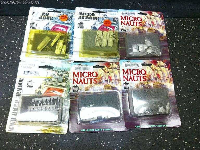 Three packages of Micro Armour and three packages of Micronauts