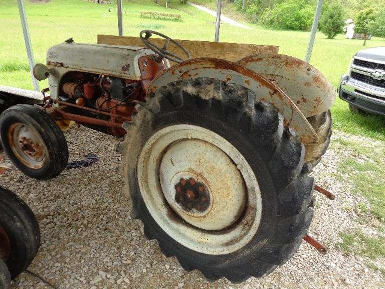 Ford 8N Tractor. 21,947 hours. All tires weathered and cracked but holding air. This tractor runs an