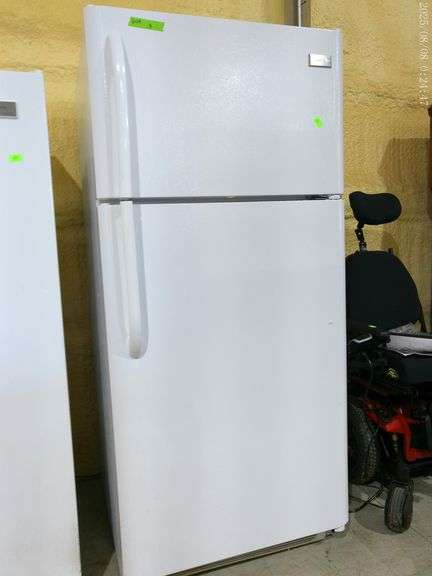 609 – Frigidaire refrigerator, freezer above. In working condition, needs cleaned.