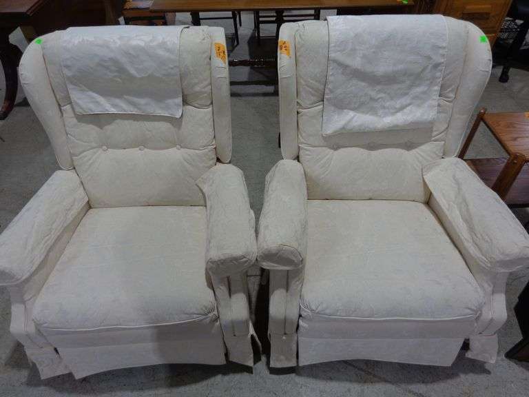 752 - pair of ivory upholstered, tufted backs rocker recliners. Very clean