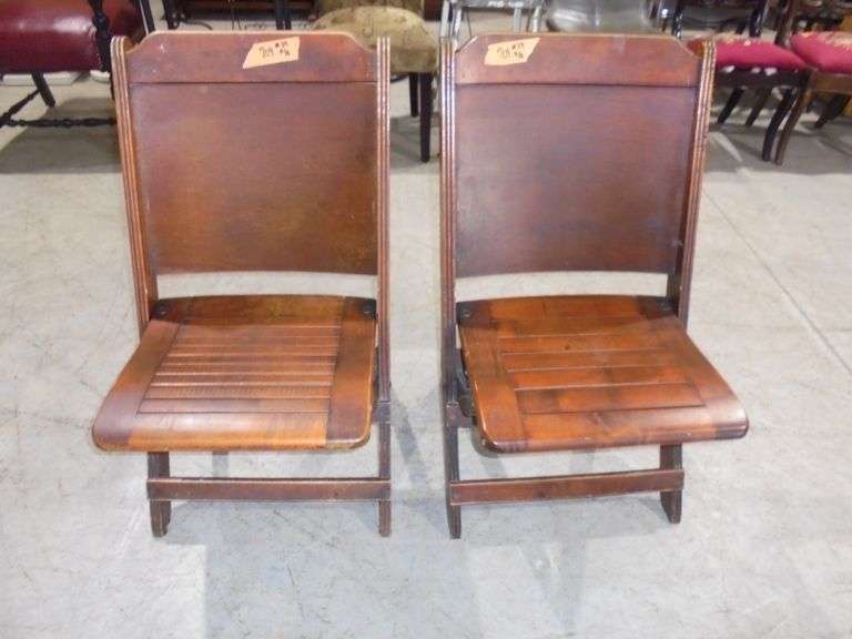 Two wood fold up chairs. See pictures.