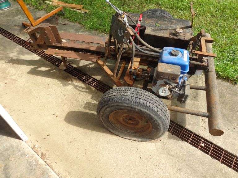 Log splitter on wheels. Untested.