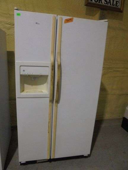 GE double door refrigerator. Works. Needs cleaned. Missing Ice canister. 35.5" wide x 30" deep x 70"
