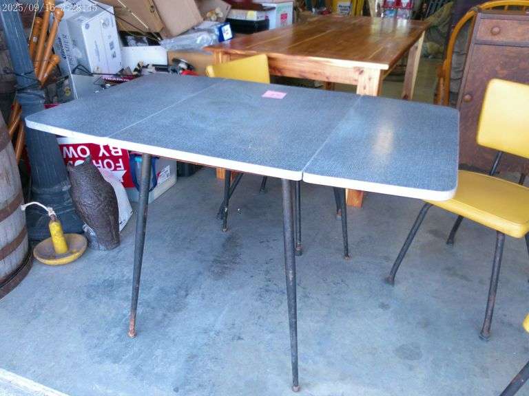 Formica top drop-leaf table with 4 chairs, Mid Century. Table is 29"T x 48"W open x 30" W