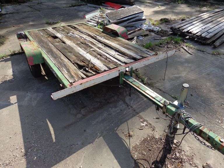 Small tilt trailer, in rough condition, 8 feet long, 4 feet wide, bad tires, boards mostly rotten