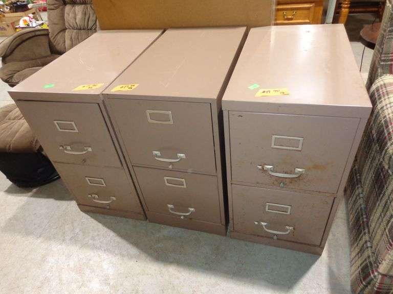 751 - 3 two drawer metal file cabinets. Some rust damage, drawers work very well