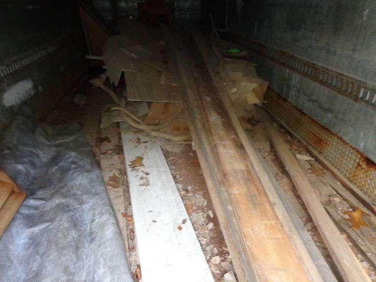 Contents of box trailer, including batteries, cedar house vents and wood. Granite counter tops are n