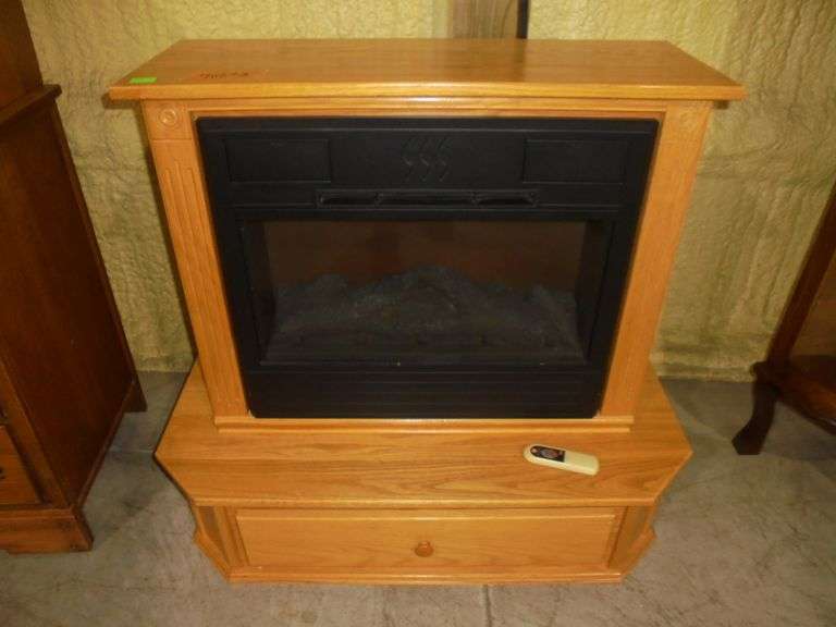 Heat Surge electric fireplace with 1 drawer and book. . Works. 2 pieces. 38" wide on base x 35" tall