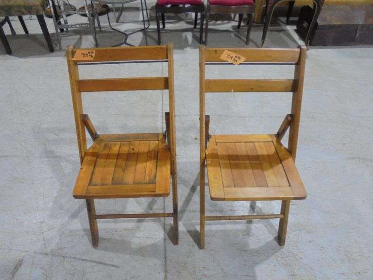Two wood folding chairs. Both say Marion county republican central committee on the back. See pictur