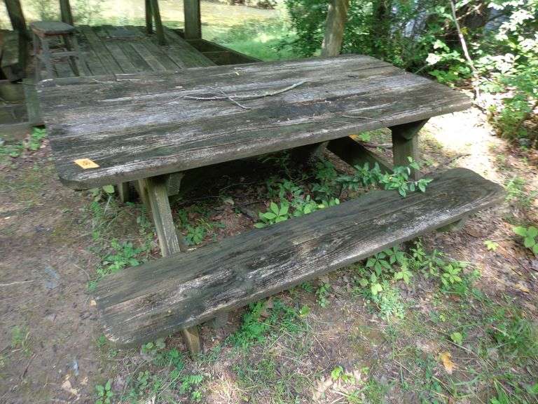 Wooden picnic table, 6 feet long, in rough condition