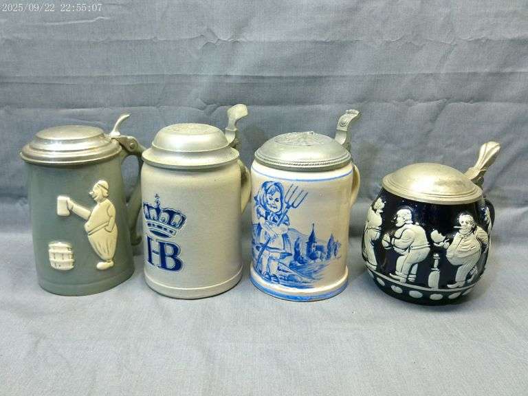 4 half liter antique steins