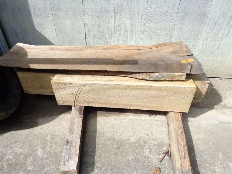 3 10x5 wooden beams, 1 3x9 wooden beam, all are buckeye. 2 2.5 inch thick 5 foot long planks
