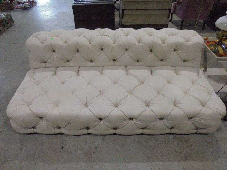 Cream colored tufted sofa. Does need some light cleaning. See pictures. Bring help loading.