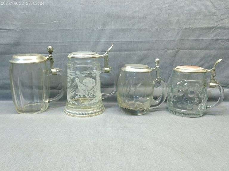 4 clear glass half liter steins