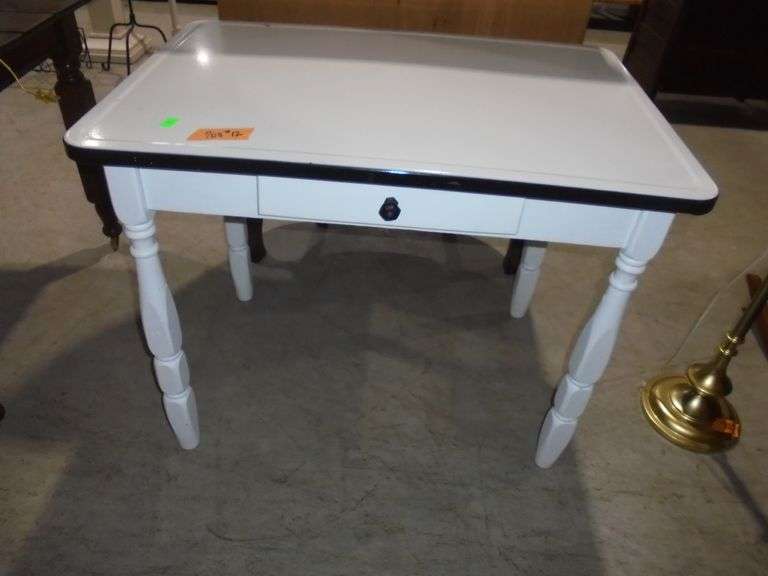 Porcelain top table with 1 drawer. 36" wide x 25" deep x 29" tall. See pictures.