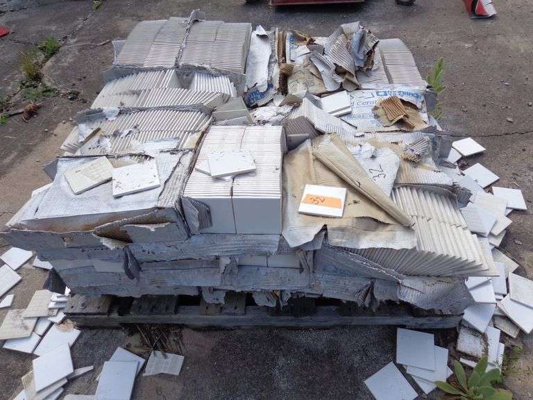 Pallet of 4"x4" ceramic tile squares, boxes are deteriorated, some tiles are broken
