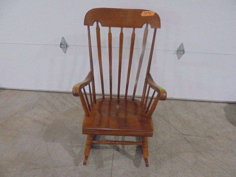 Antique wood rocking chair with seat cushion. See pictures.