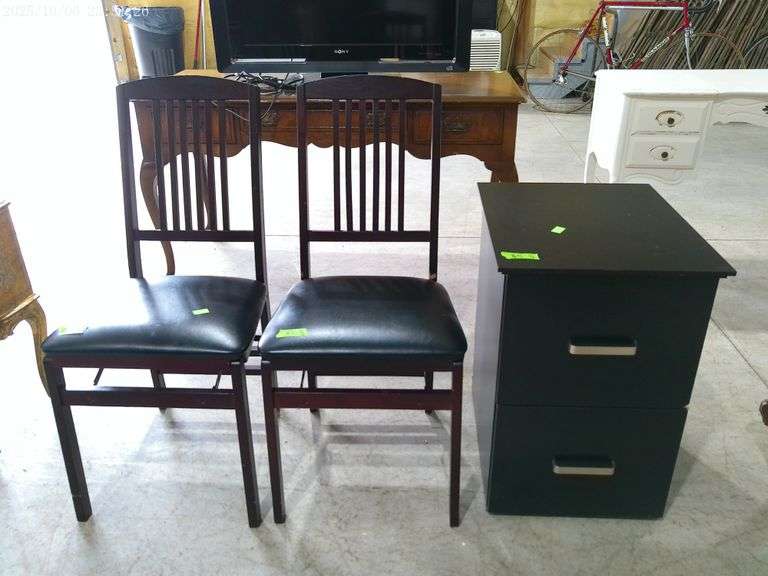 810- Black 2 drawer filing cabinet and a pair of wooden and black vinyl folding chairs