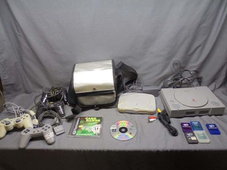 Sony PlayStation 1 (tested for power) and Sony PlayStation (no powercord) with 4 controllers, 2 game