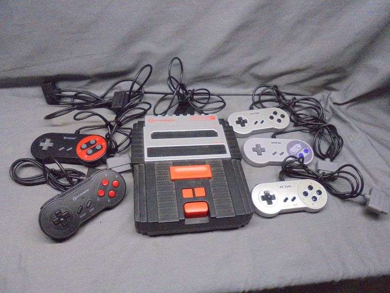 Hyperkin Retro 2 game system with five remotes. tested for power only.