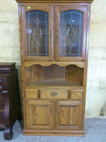 808- Oak and glass corner cabinet in good condition