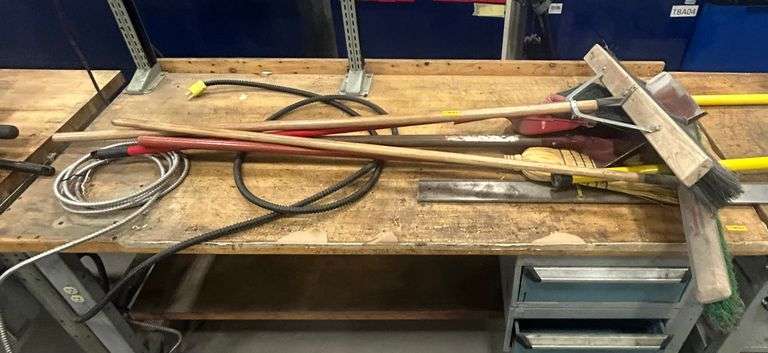 Assorted Brooms and Shovels