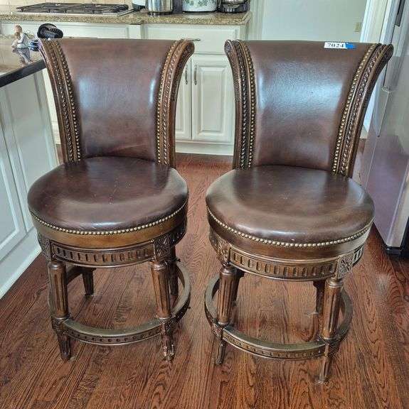 Two spring loaded swivel low bar stools