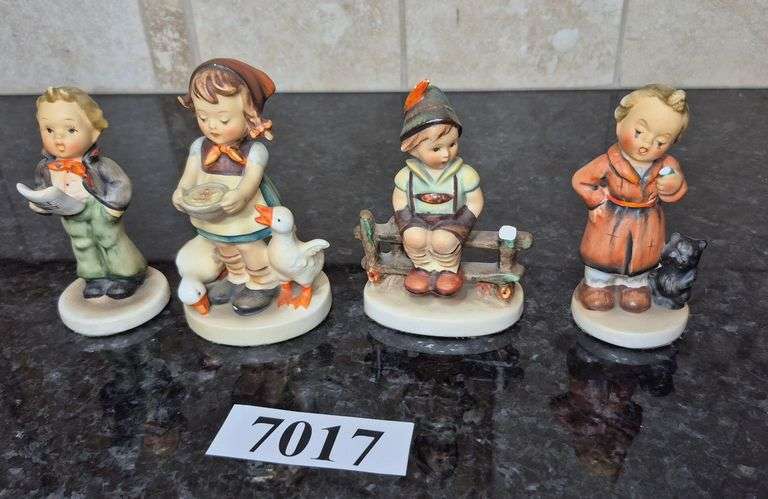 Four Hummel figurines