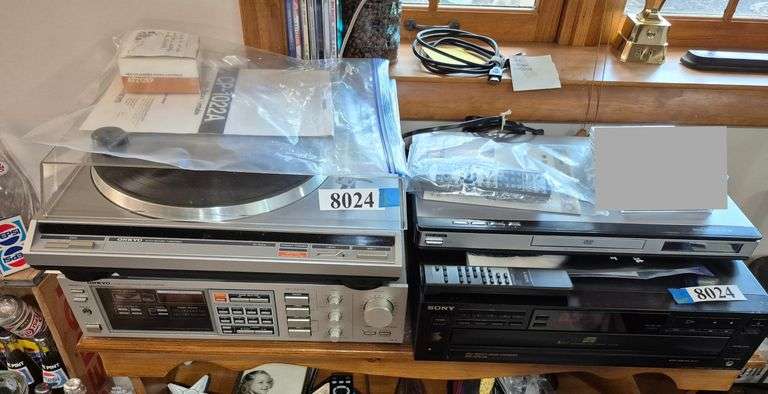 Onkyo receiver and turntable, Sony 5 disc changer with remote, Go video DVD player with remote and m