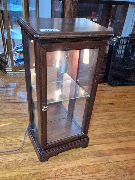 Small lighted display cabinet with mirrored back