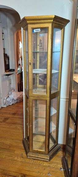Gold lighted curio cabinet with mirrored back